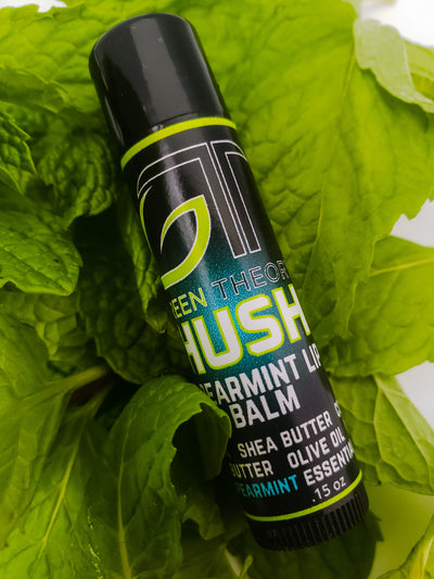 photo of green theory Hush all natural lip balm laying on a bed of spearmint leaves