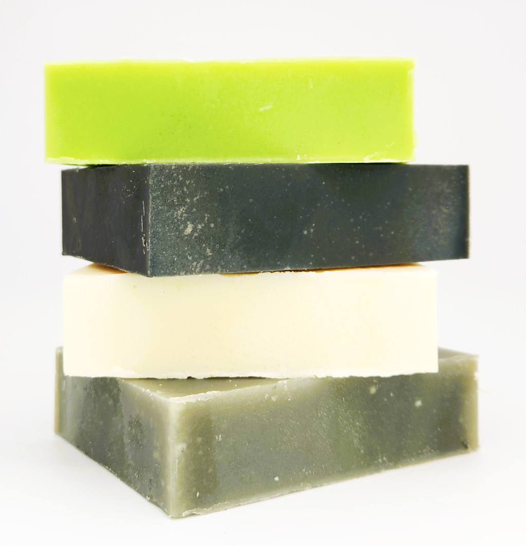 green theory all natural soap bars stacked on top of each other
