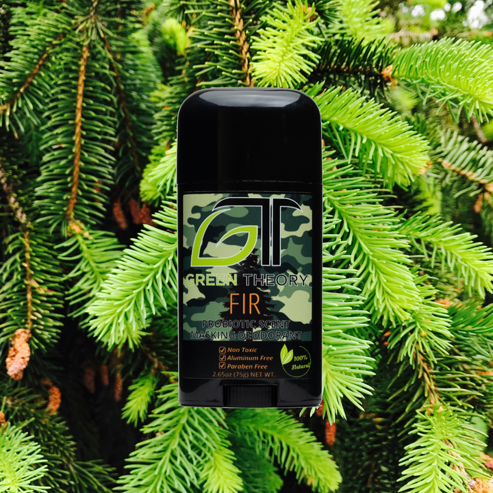 green theory aluminum free, probiotic deodorant for daily wear or hunting product photo imposed over image of fir needles