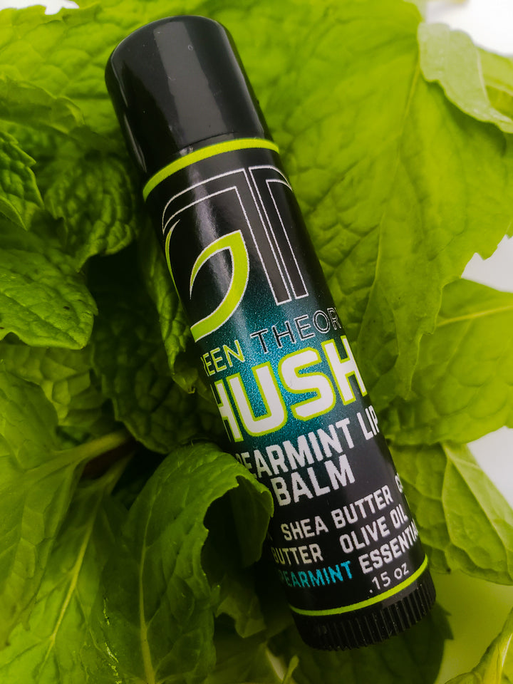 photo of green theory Hush all natural lip balm laying on a bed of spearmint leaves
