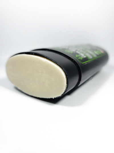 photo of deodorant laying on its back with the cap off depicting the texture of green theory natural probiotic deodorant.