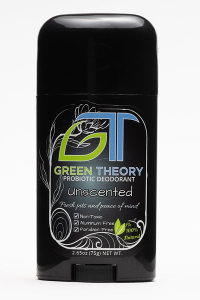 photo of the front of Green Theory Unscented probiotic aluminum free natural deodorant. Stick is standing upright against a pure white background. The container is a sleek black plastic stick. The front label contains a greyish white orb with a floral looking frame. The Green Theory GT logo is prominent at the top with the G stylized like a leaf. "Unscented" is written below with "fresh pits and peace of mind" and then "non toxic", "aluminum free" and "paraben free" listed as product benefits