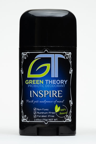 photo of the front of Green Theory Inspire probiotic aluminum free deodorant for women. Container is shiny blck plastic and is against an all white background. Label features an artistic white frame. The top of the label is a large GT green theory logo with the G in the shape of a leaf. Below are the words "probiotic deodorant" and "Inspire" written in white and then "fresh pits and peace of mind" in a cursif font with "non toxic", "aluminum free" and "paraben free" listed as benefits