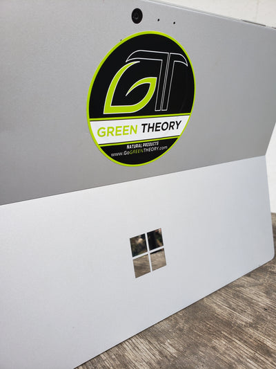 Green Theory sticker on laptop cover